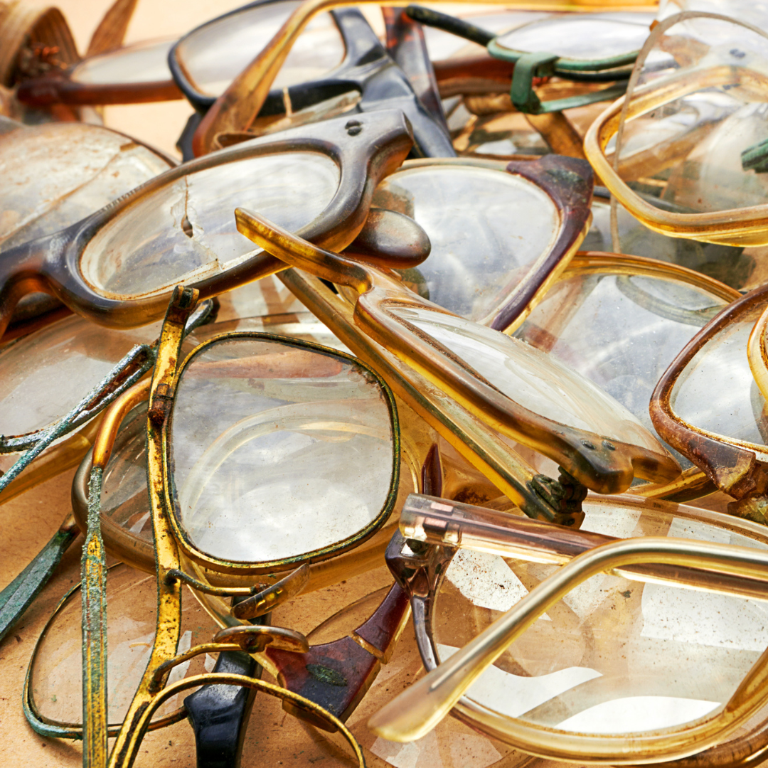 Pile of old and broken glasses for recycling